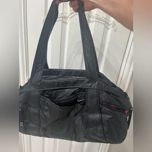 - Nike gym bag black with pink interior many pockets